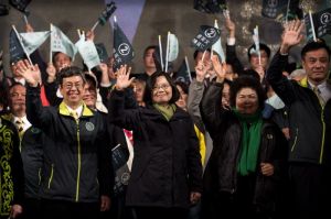 Democratic Progressive Party (DPP) presidential candidate Tsai Ing-wen (C) celebrates her victory inTaipei on January 16, 2016.  Voters in Taiwan elected a Beijing-sceptic president in a dramatic democratic journey, carving their own political path against China's wishes. AFP PHOTO / Philippe Lopez / AFP / PHILIPPE LOPEZ