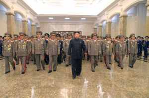North Korean leader Kim Jong Un (C) visits the Kumsusan Palace of the Sun to pay tribute to founding President Kim Il Sung and former leader Kim Jong Il to mark the 61st anniversary of the victory of the Korean people in the Fatherland Liberation War, in this file photo released by North Korea's Korean Central News Agency (KCNA) in Pyongyang July 27, 2014. Kim is suffering from "discomfort", state media has said in the first official acknowledgement of ill health after a prolonged period out of the public eye. Kim, 31, who is frequently the centrepiece of the isolated country's propaganda, has not been photographed by state media since appearing at a concert alongside his wife on September 3, fuelling speculation he is suffering from bad health. He had been seen walking with a limp since an event with key officials in July and in a pre-recorded documentary broadcast by state media on September 25, 2014 appeared to have difficulty walking. REUTERS/KCNA (NORTH KOREA - Tags: POLITICS PROFILE TPX IMAGES OF THE DAY ANNIVERSARY) ATTENTION EDITORS - THIS PICTURE WAS PROVIDED BY A THIRD PARTY. REUTERS IS UNABLE TO INDEPENDENTLY VERIFY THE AUTHENTICITY, CONTENT, LOCATION OR DATE OF THIS IMAGE. FOR EDITORIAL USE ONLY. NOT FOR SALE FOR MARKETING OR ADVERTISING CAMPAIGNS. THIS PICTURE IS DISTRIBUTED EXACTLY AS RECEIVED BY REUTERS, AS A SERVICE TO CLIENTS. NO THIRD PARTY SALES. NOT FOR USE BY REUTERS THIRD PARTY DISTRIBUTORS. SOUTH KOREA OUT. NO COMMERCIAL OR EDITORIAL SALES IN SOUTH KOREA